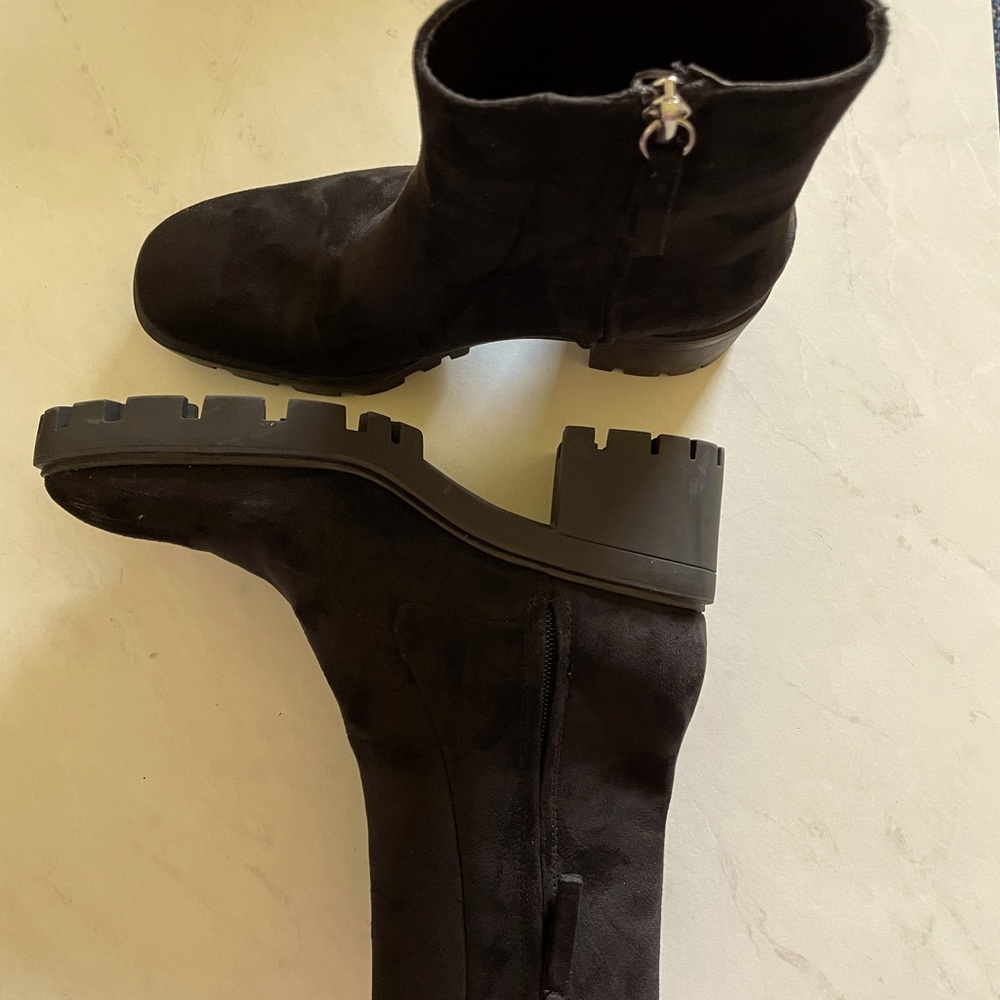 Zippered ankle boots with thick lug soles.